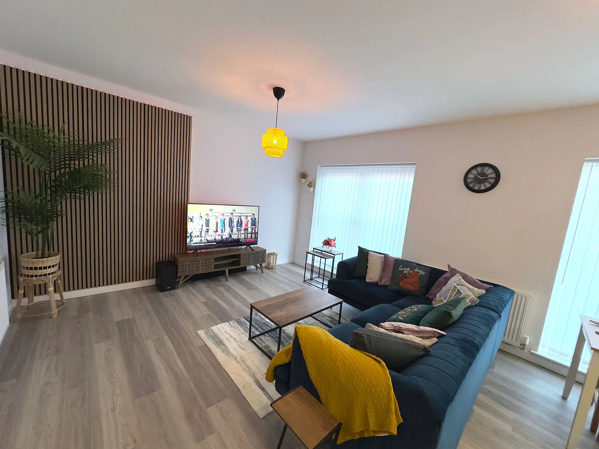 Living area with slatted feature wall and natural light